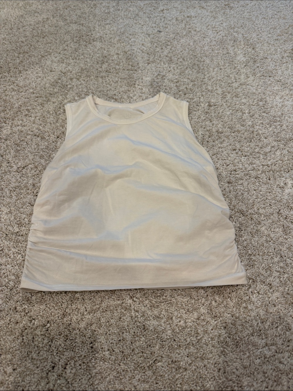 Lululemon white cinch side tank size 2. Great condition.
